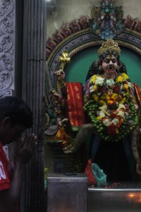 Praying to another Kali statue. 
