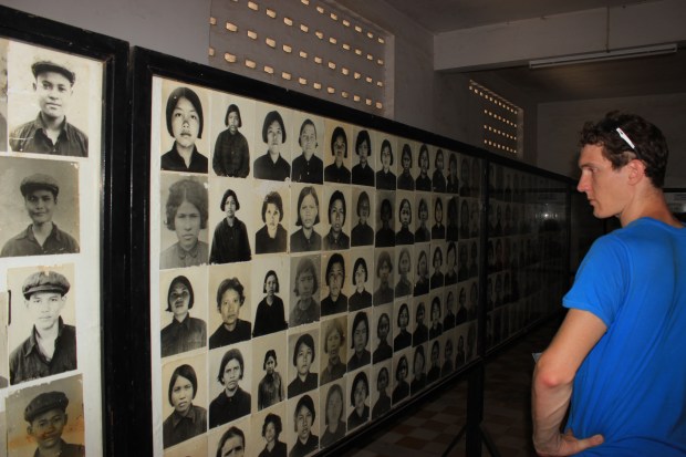 A tourist looks at all the victims of S-21. Prison officials catalogued every prisoner that entered the jail.