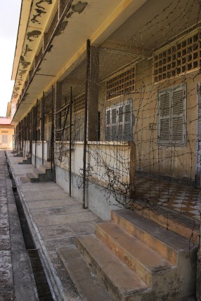 The reality of S-21, a former Khmer Rouge prison in Phnom Penh. Each small room is a cell that used to house prisoners.